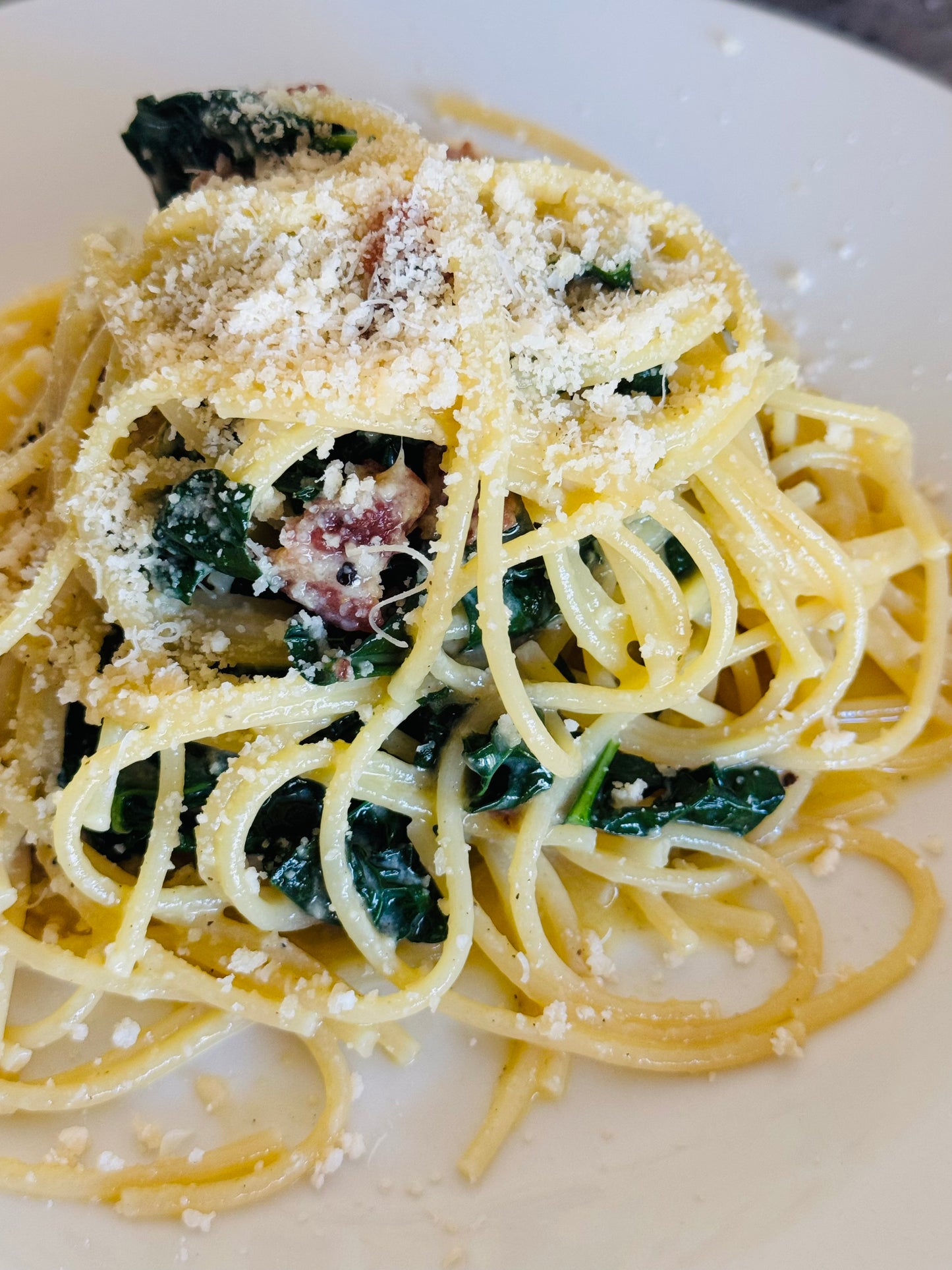 Pasta Carbonara with bacon and organic kale